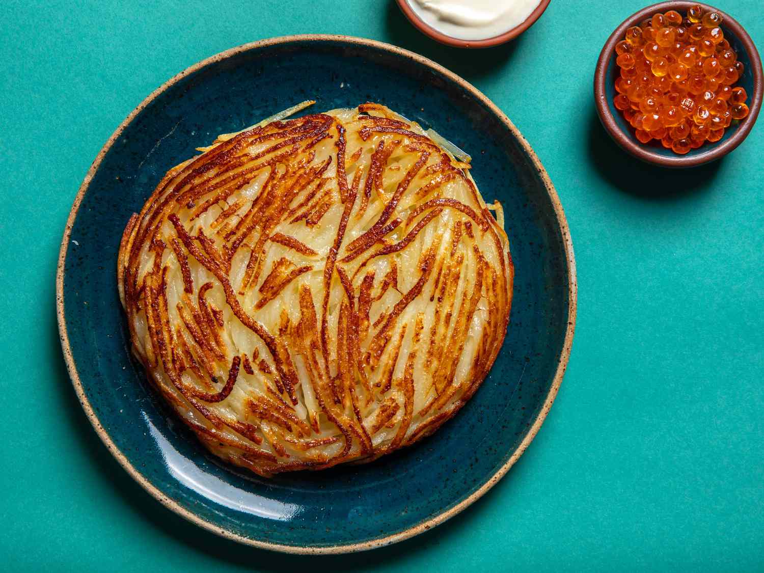 The pommes Darphin on a serving plate.