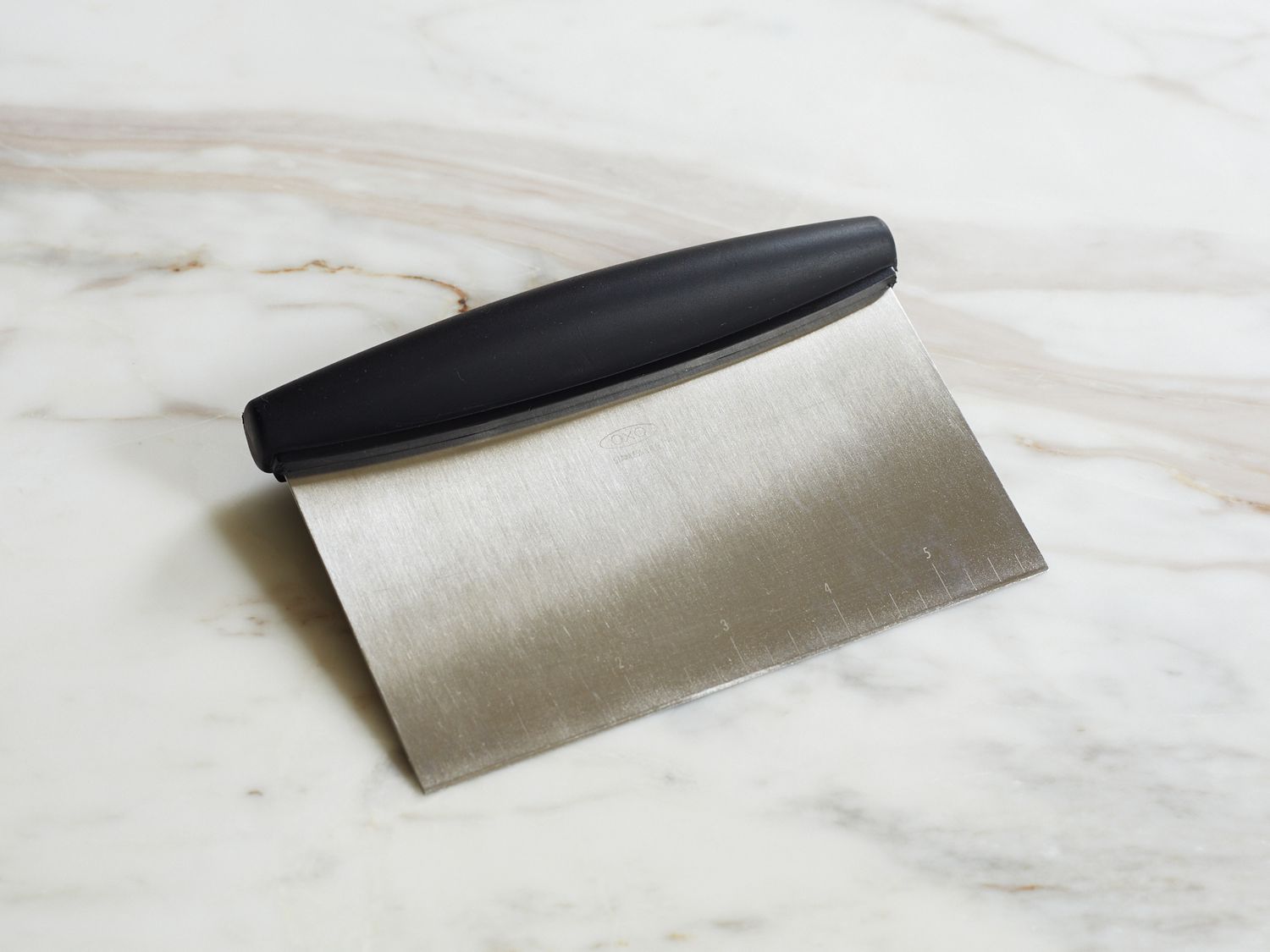 The OXO Bench Scraper on a kitchen counter