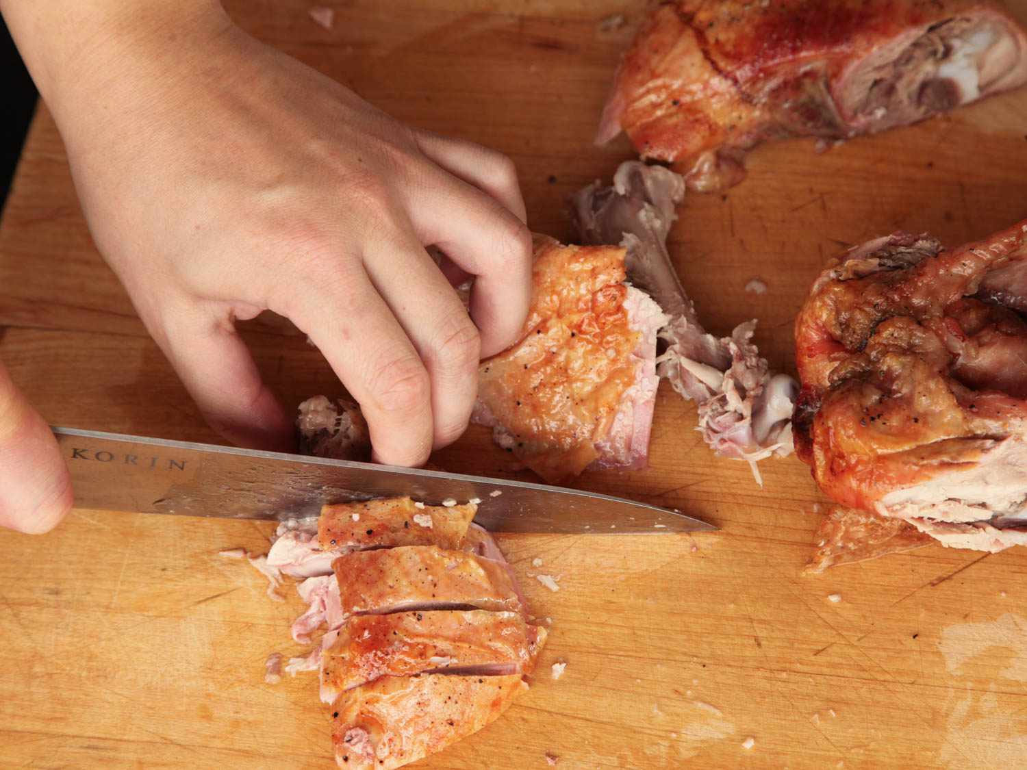 slicing deboned roasted turkey thigh