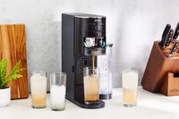 Ninja Thirsti Drink System dispensing drink into glass cups