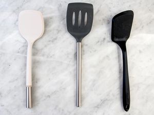 Three nonstick food turners on a marble counter