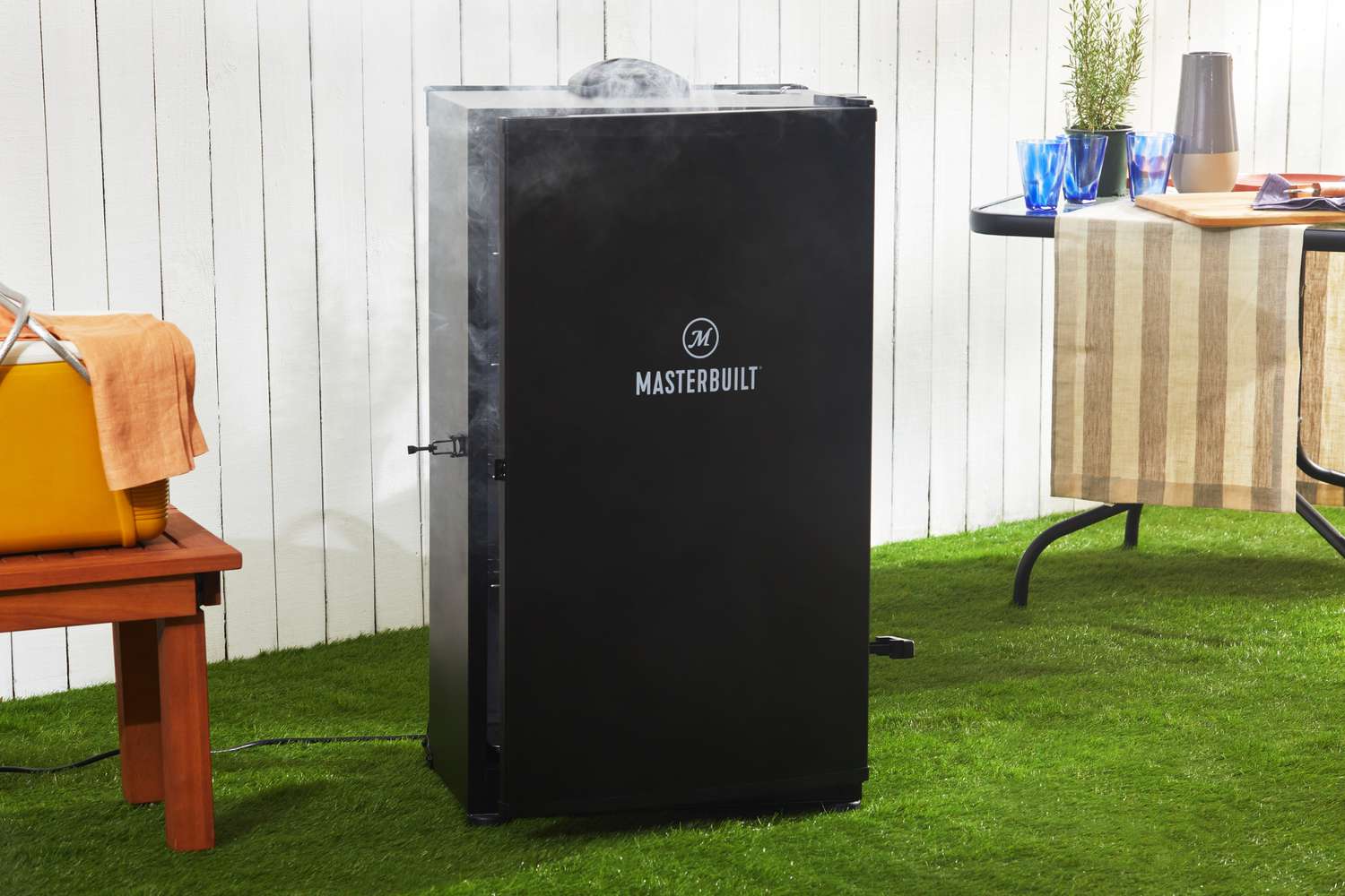 Masterbuilt MB20072918 40-Inch Digital Electric Smoker displayed on grass