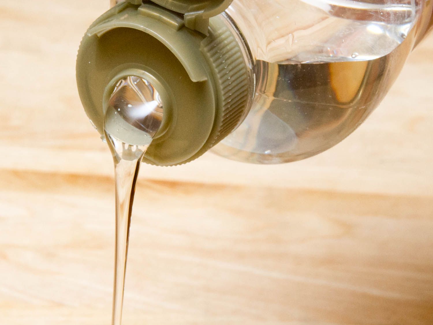 Corn syrup pouring out of a bottle. 