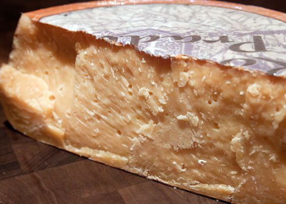 A half-wheel of gouda cheese.