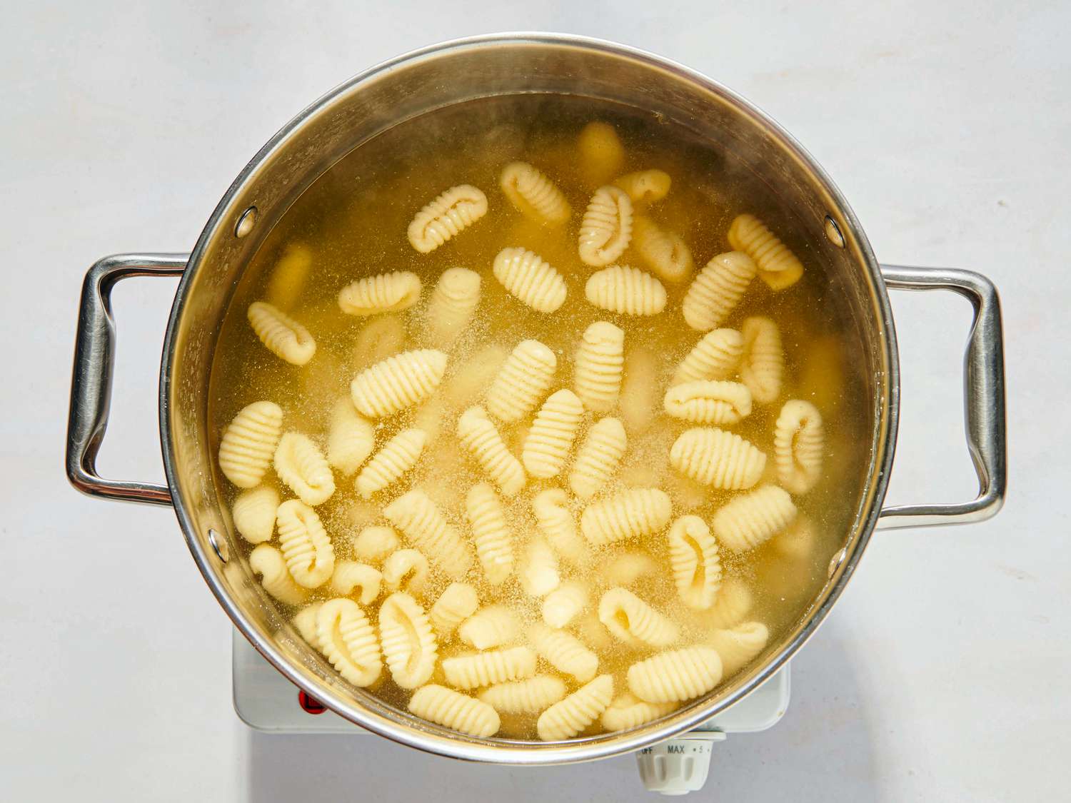 Pasta cooking in a large pot of water 