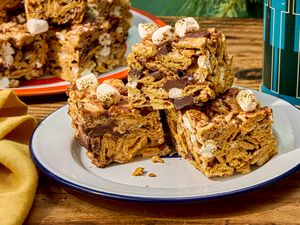 Stacked smores rice krispie treats on a plate