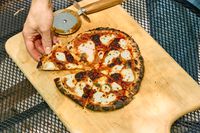 A pizza cooked in the Ooni Koda 2 Max Gas Powered Pizza Oven