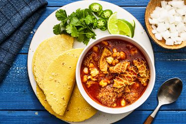 Overhead view of menudo rojo in a bowl in a plate