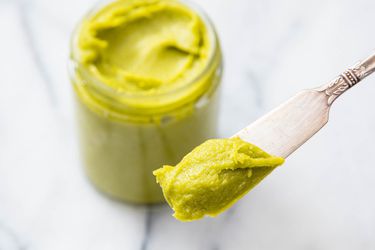 A jar of homemade pistachio paste. 