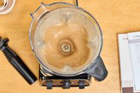An overhead view of the Vitamix 7500 blending items without a lid