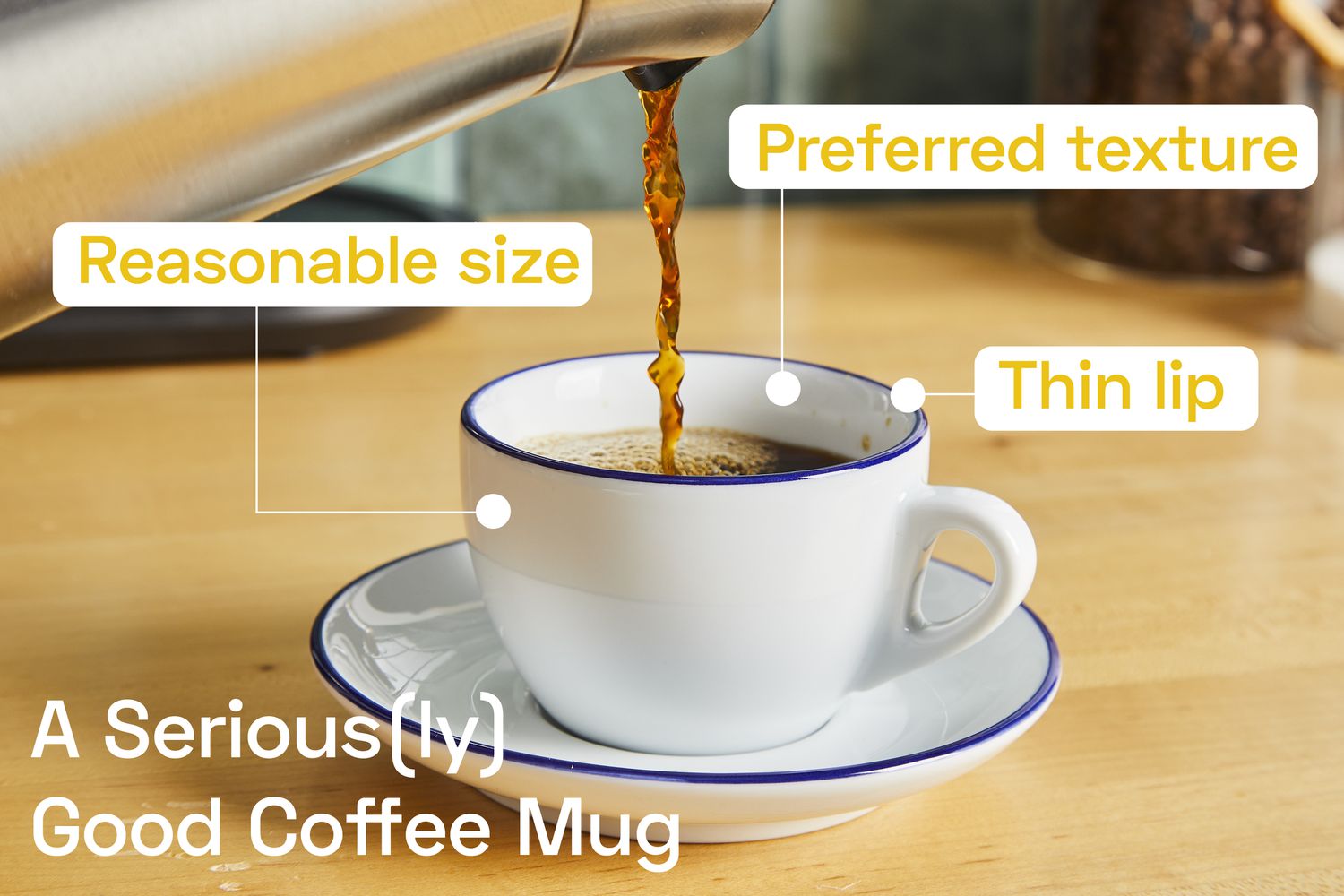 Coffee being poured from a carafe into a coffee mug.