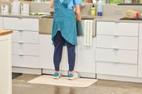 A person stands on The House of Noa Nama Standing Mat