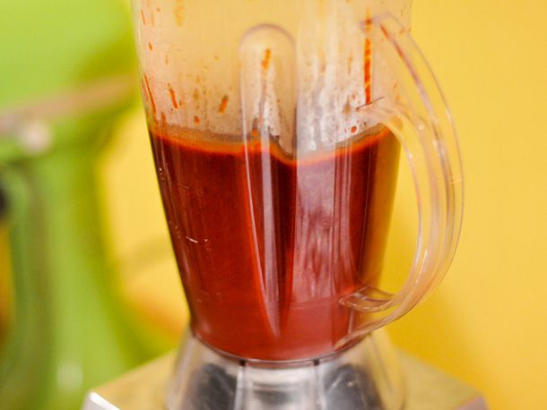 Closeup of the sauce being puréed in a blender.