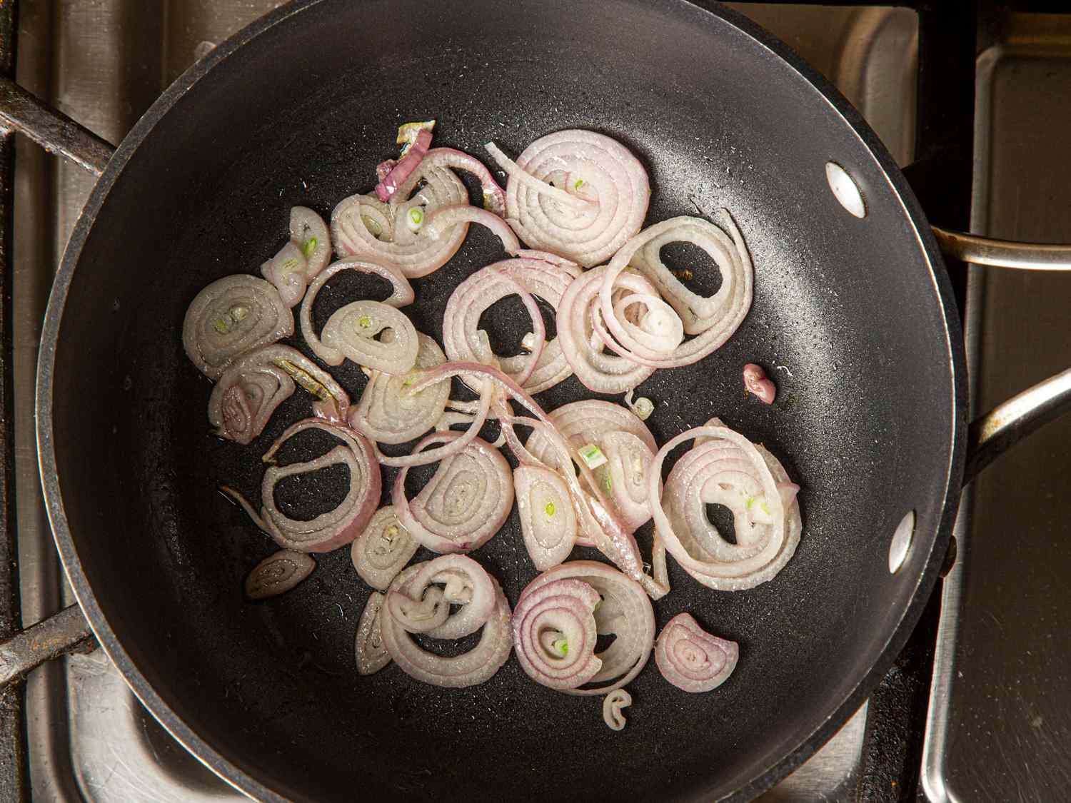Overhead view of shallots in pan