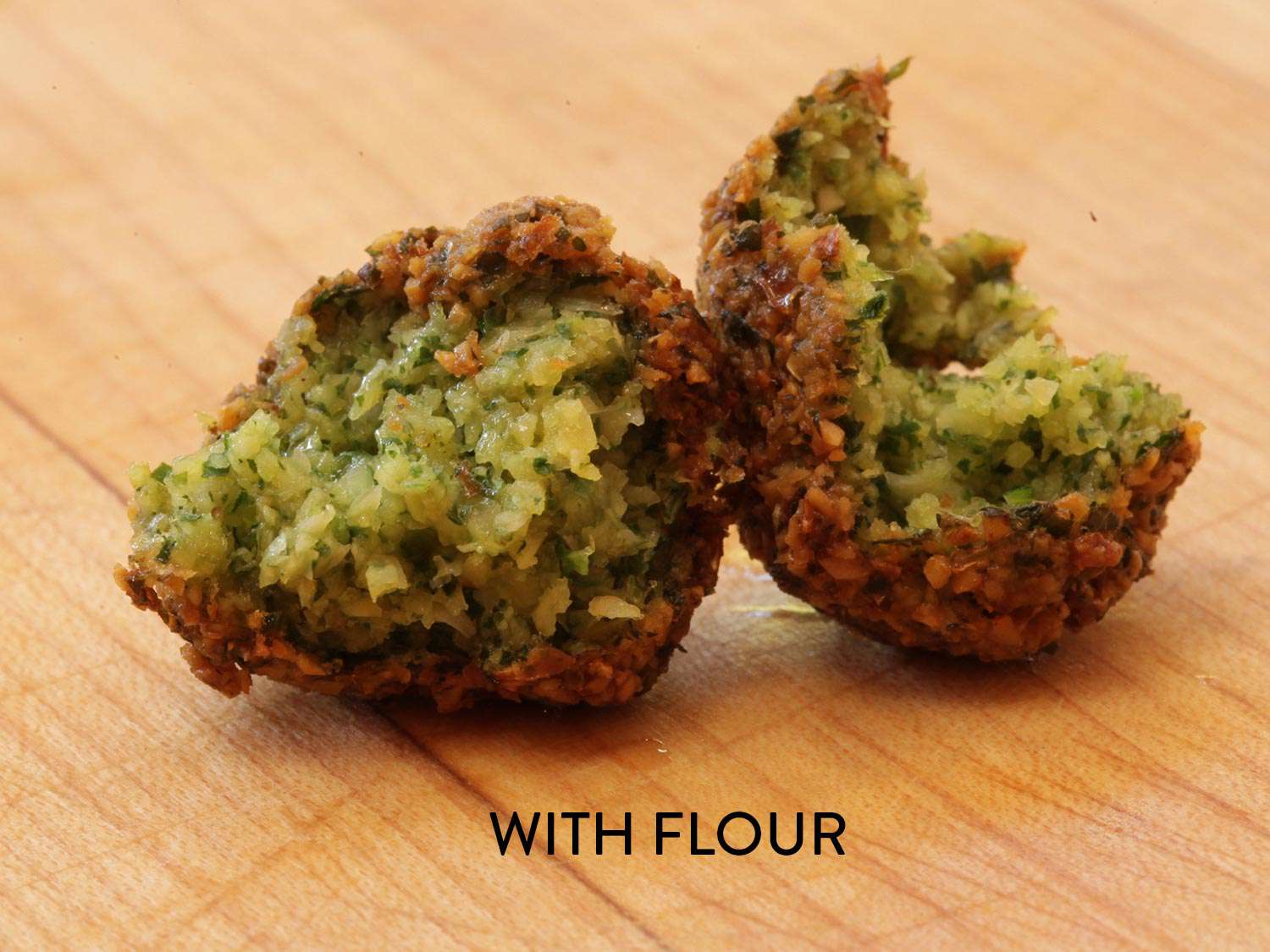 A ball of falafel, broken open to display the wet interior. The image is labeled with the words "with flour."