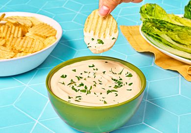 Dipping a chip in the caesar dip