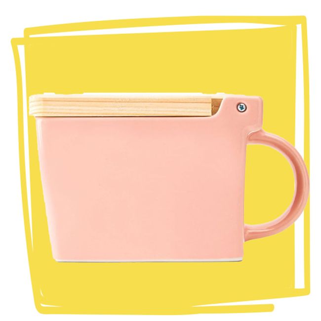 A salt box shaped like a cup with a wooden lid designed by Zero Japan