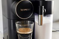 A close up of the Nespresso Gran Lattissima Original Espresso Machine by De’Longhi with a cup of espresso