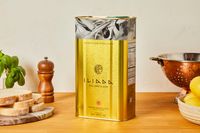 A tin of extra-virgin olive oil on a kitchen countertop.