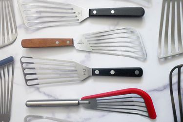 fish spatulas on a marble countertop