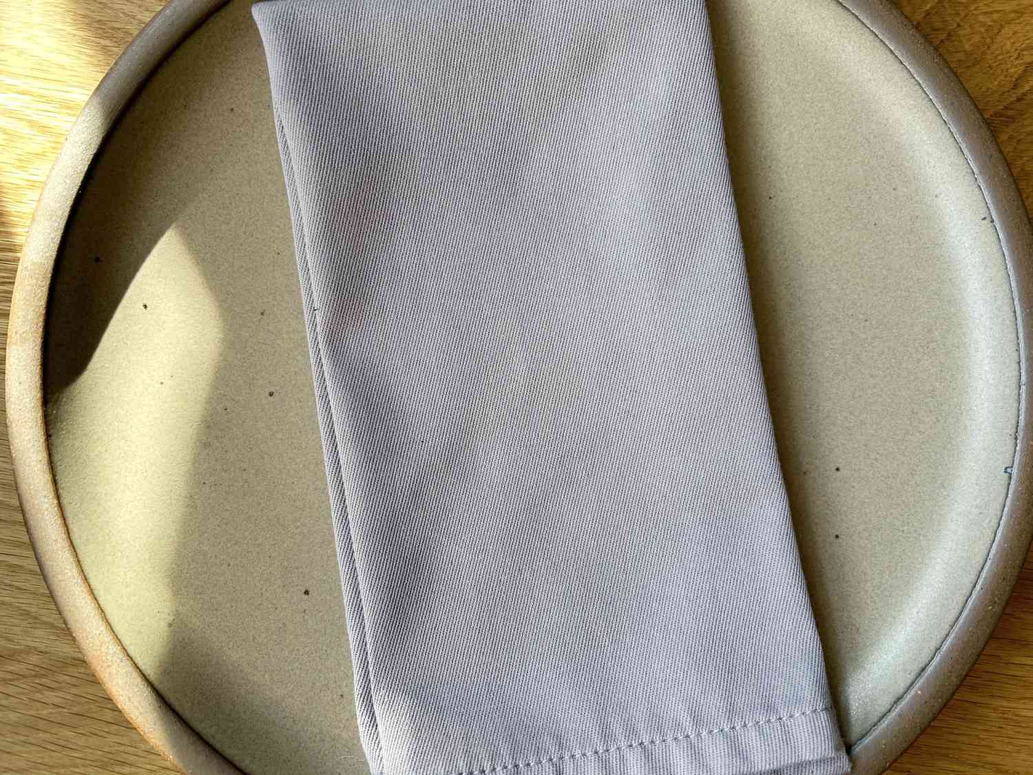 A purple cloth napkin on a plate