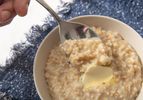 Bowl of instant pot oatmeal in a bowl with blue textile 