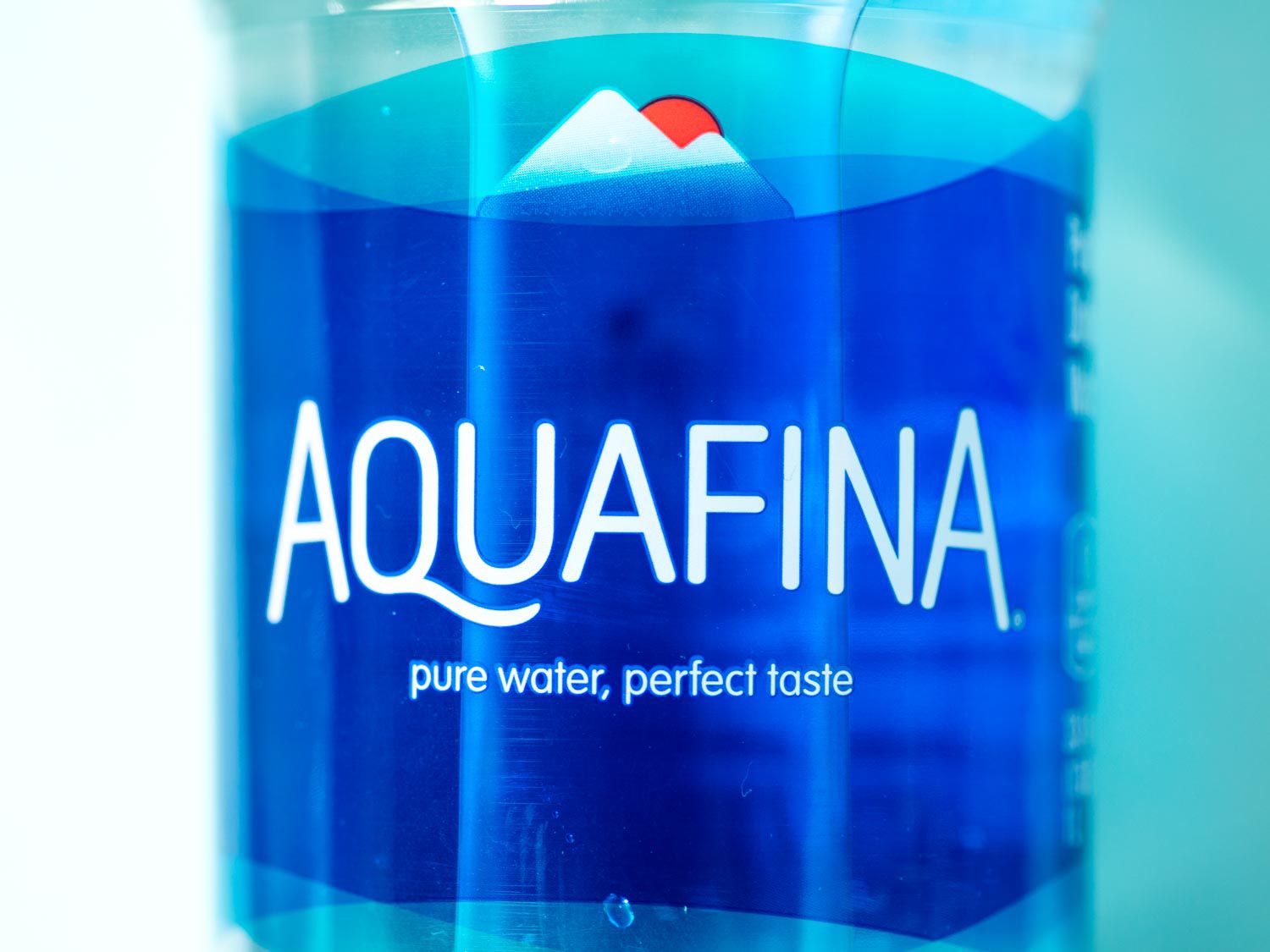 Close-up of a bottle of Aquafina water.