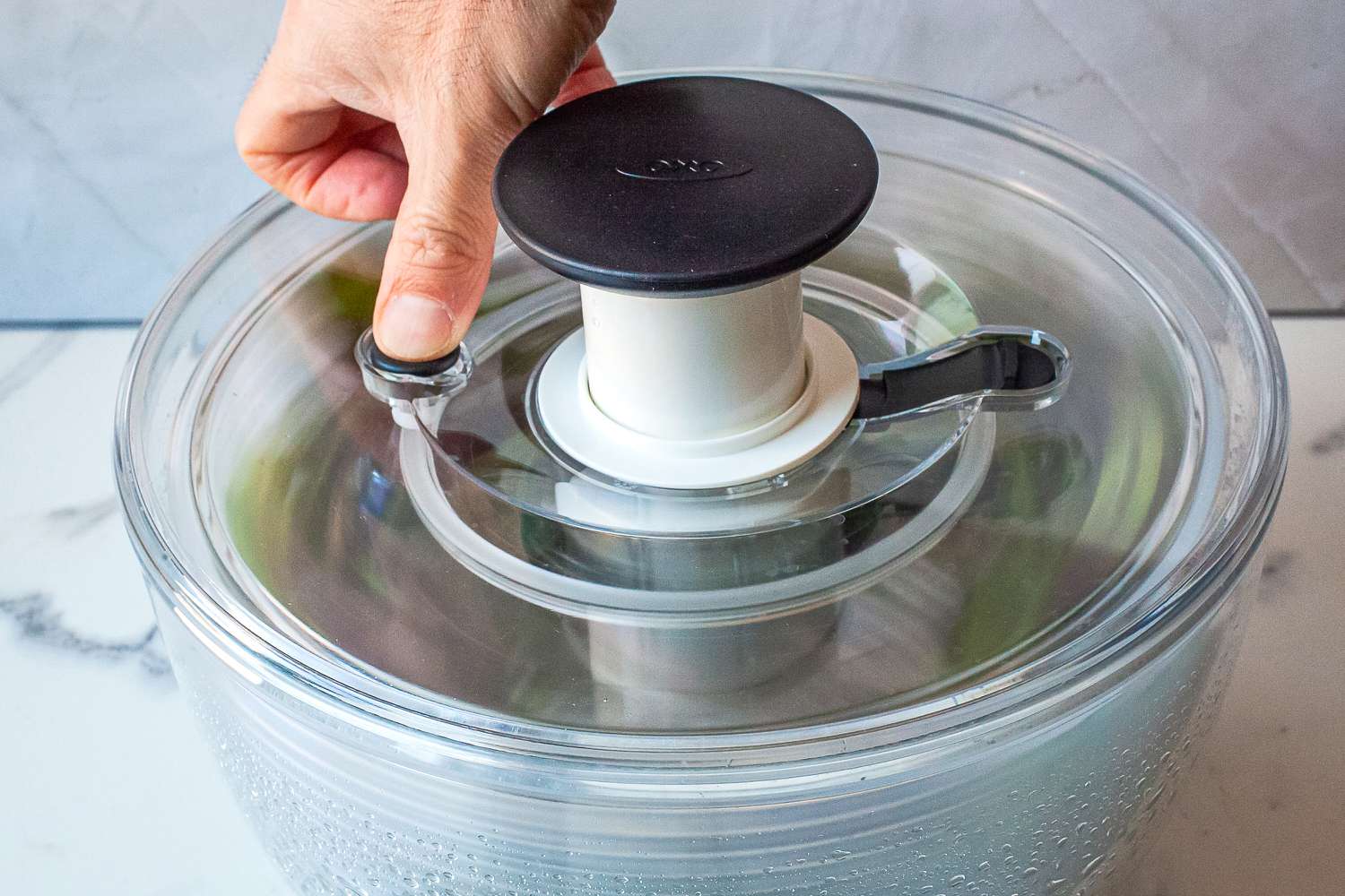 a person stopping the spinner from spinning