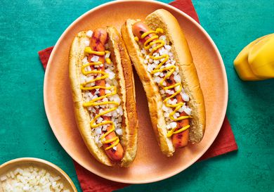 Overhead view of two hotdogs on a plate