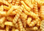 A closeup of crinklecut French fries