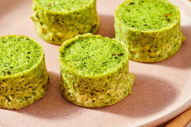 Four kale and mushroom egg bites on a plate