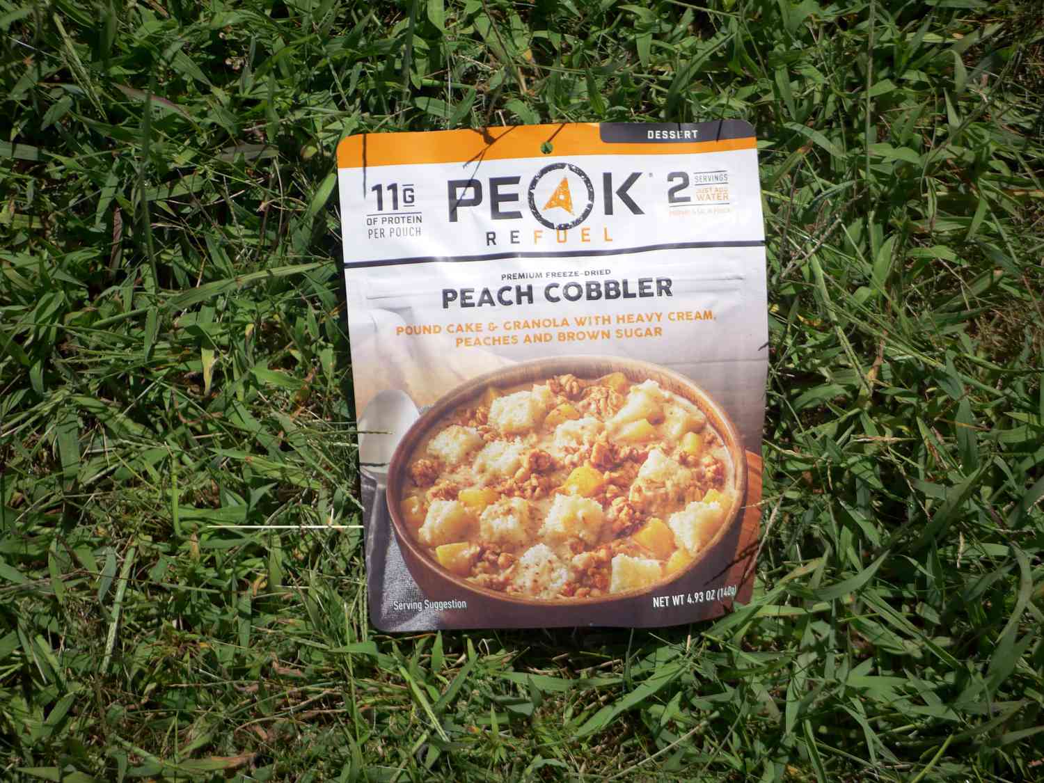 peak refuel peach cobbler on a grassy surface