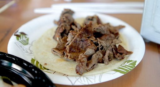 An asada taco on a paper plate at La Super-Rica