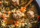 Italian wedding soup in a bowl with vegetables and meatballs