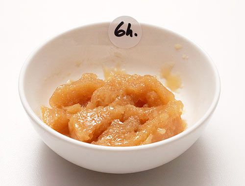 Small bowl of nearly solid pork broth with a sticker that reads six hours.