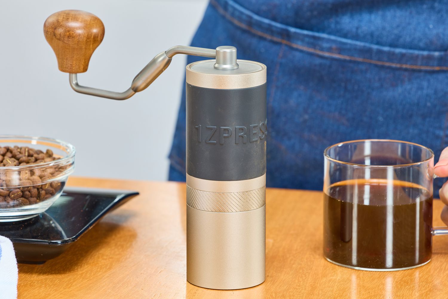 The 1Zpresso J Manual Coffee Grinder on a table