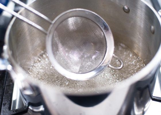 skim surface of bubbling mixture