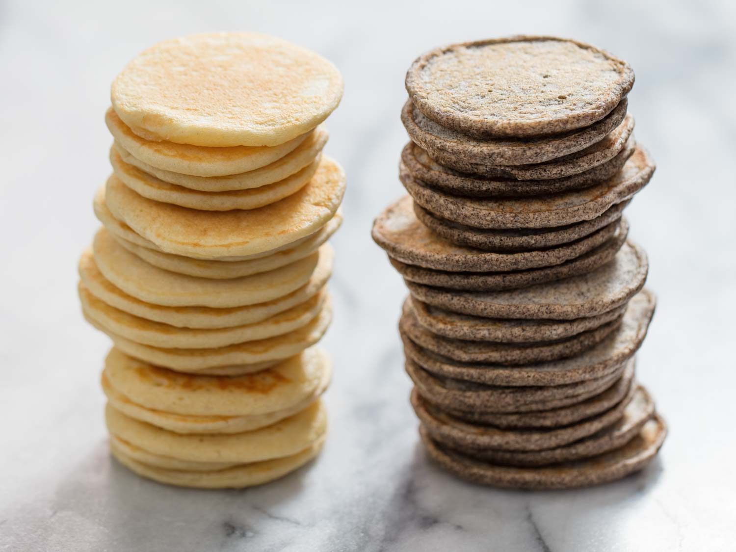 Side by side stacks of yeasted and buckwheat blini
