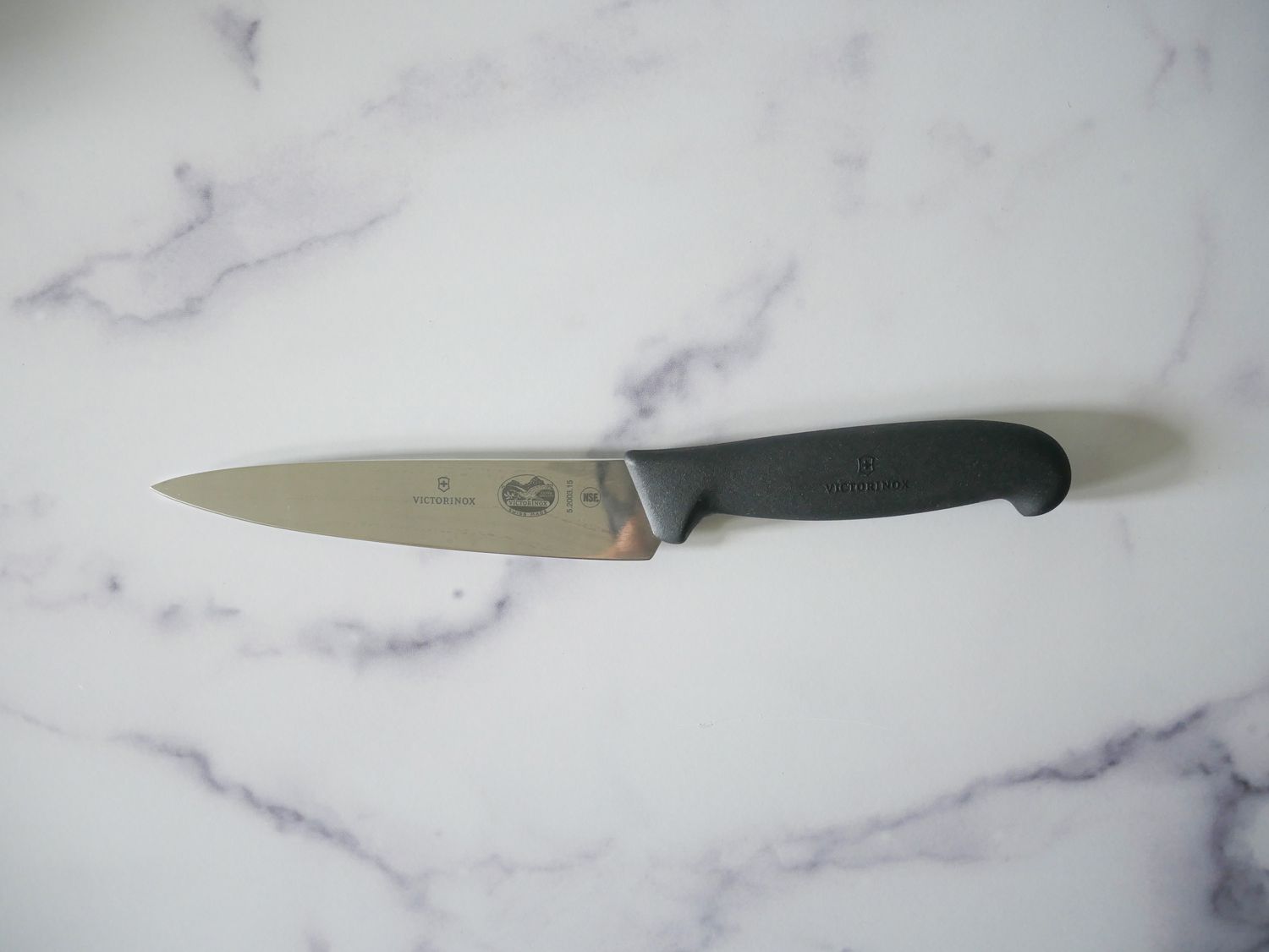 Victorinox petty knife on marble countertop