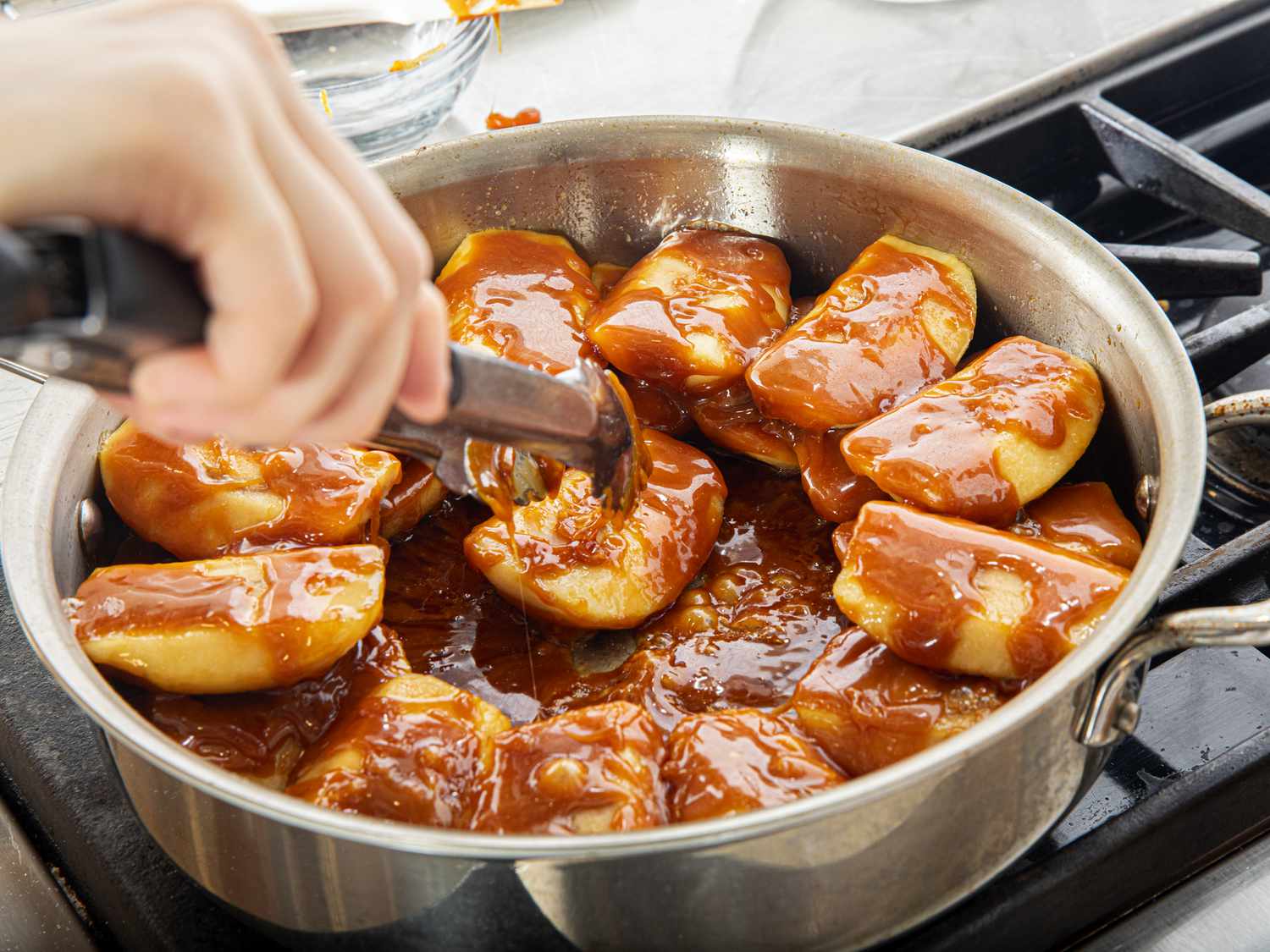 Side angle view of arranges apples in tarte tatin