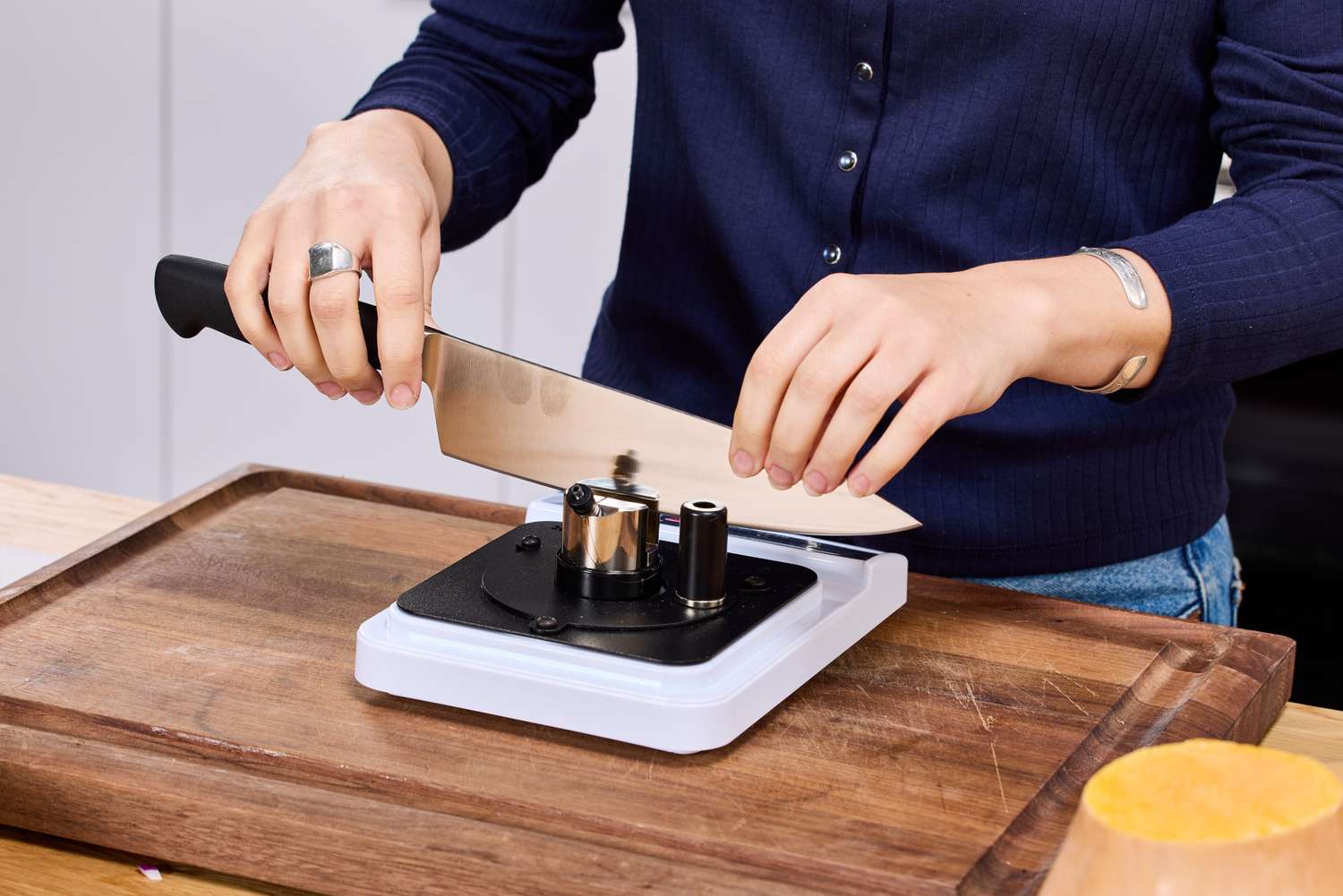 A person sharpens the Mercer Culinary 8-Inch Genesis Chef's Knife