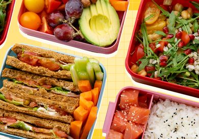 An assortment of lunchboxes with sandwiches fruits vegetables and sushi options