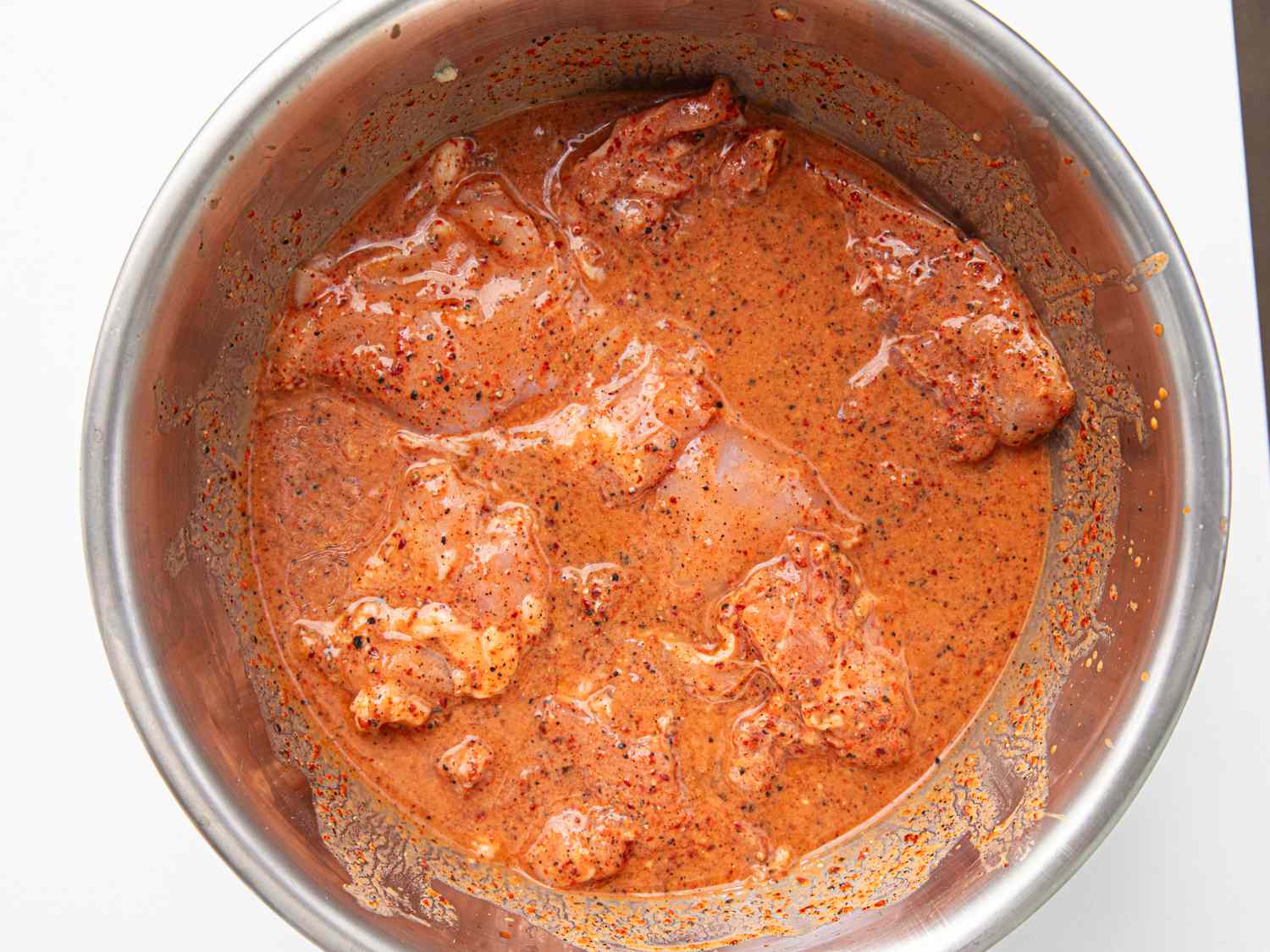 Overhead view of kimchi fried chicken marinating 