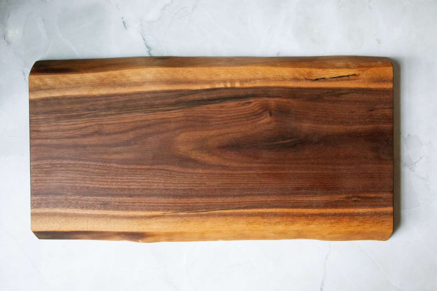 The Boardsmith charcuterie board on a marble countertop.