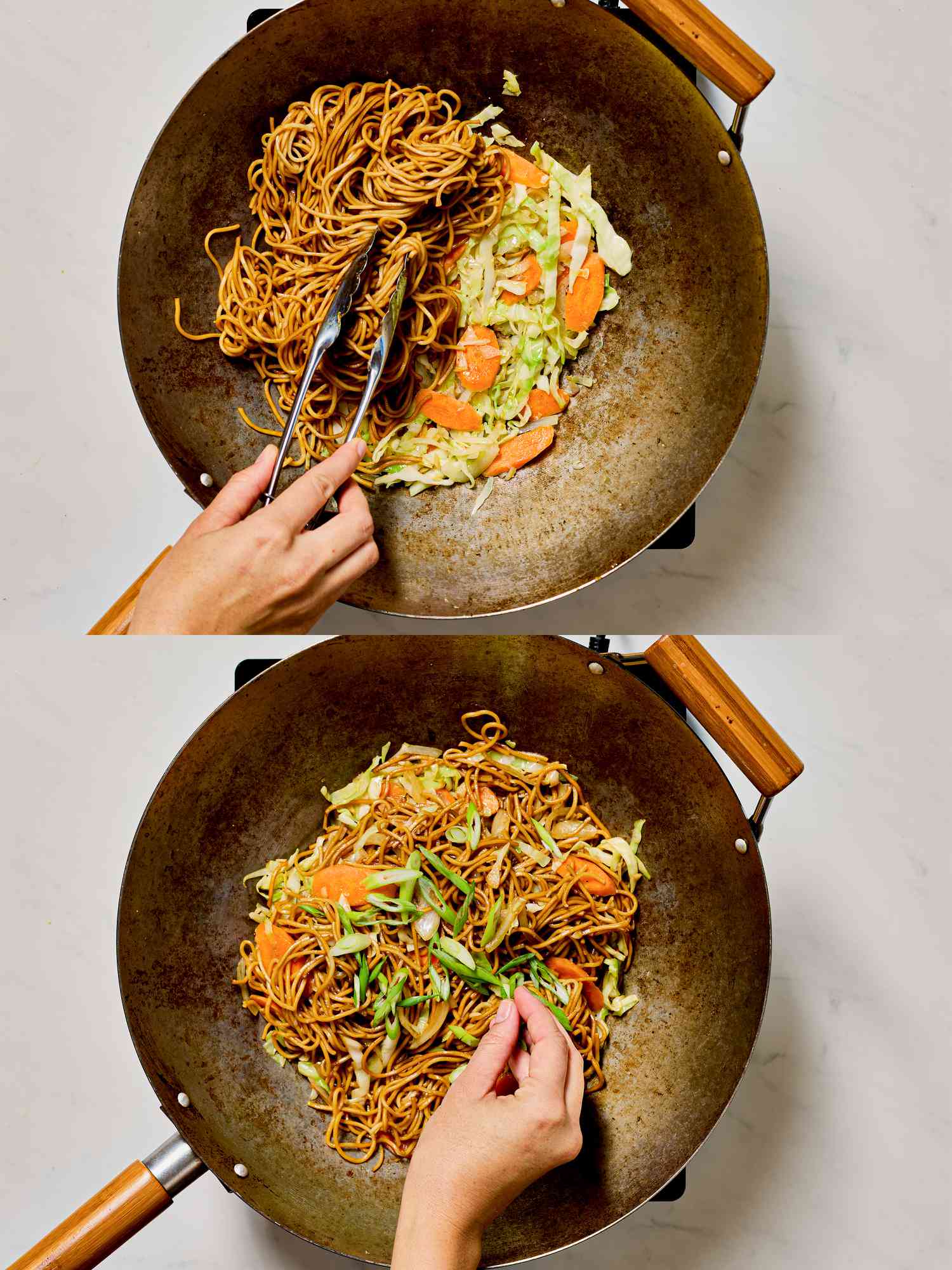 Stir-frying noodles and vegetables in a wok.