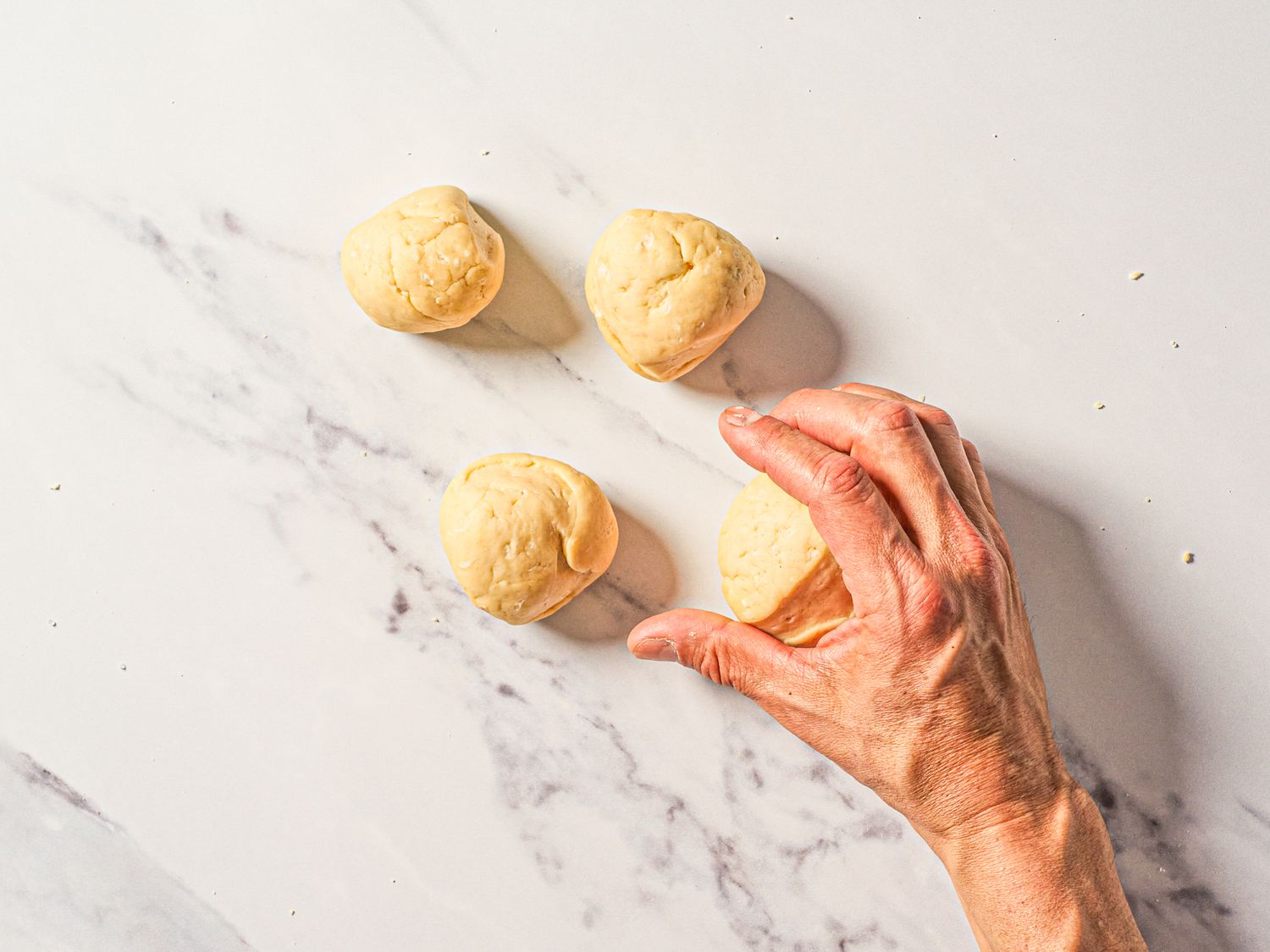 Dough shaped into 4 balls