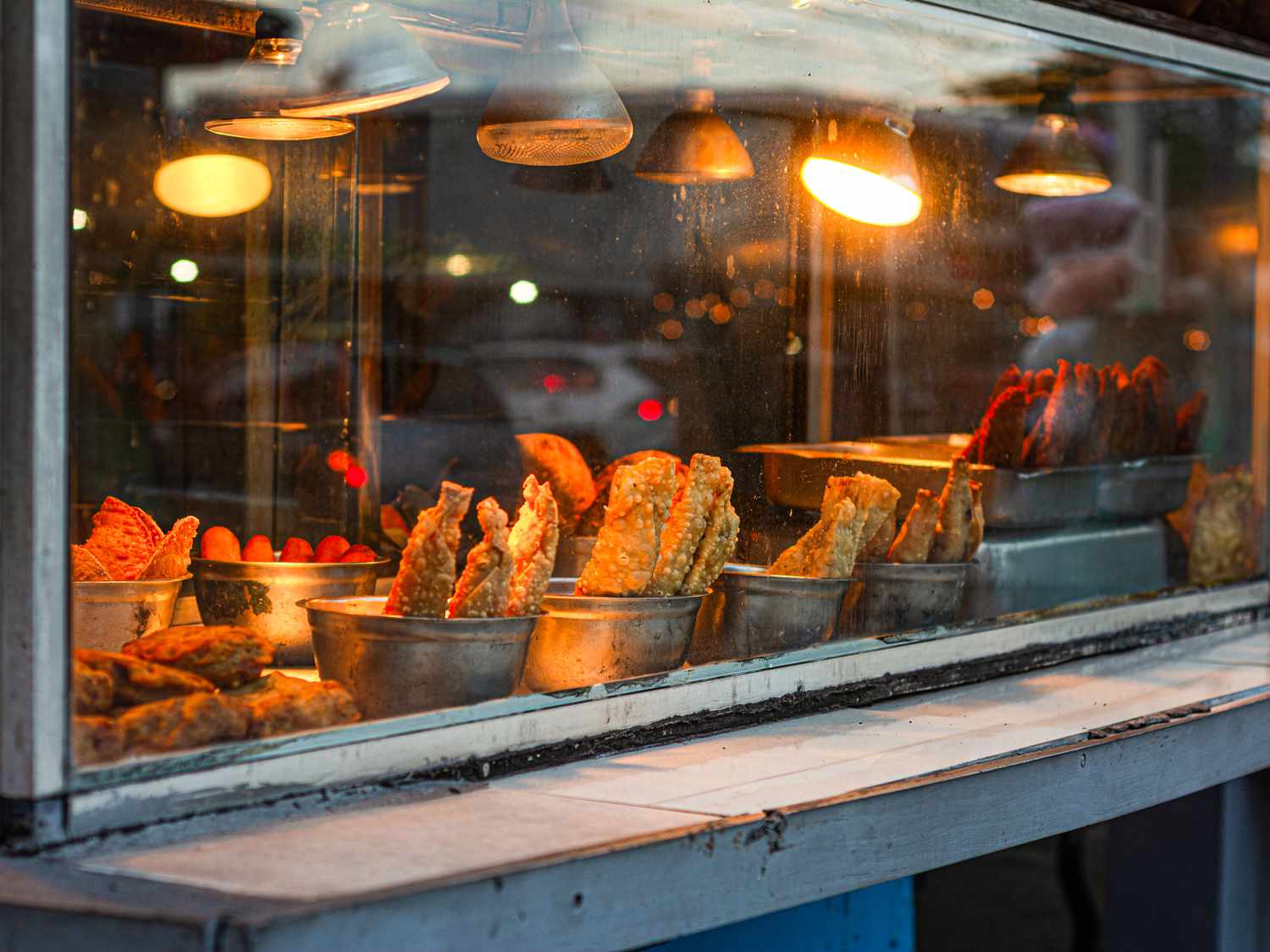 Fritters under heat lamps along Playa Aviones