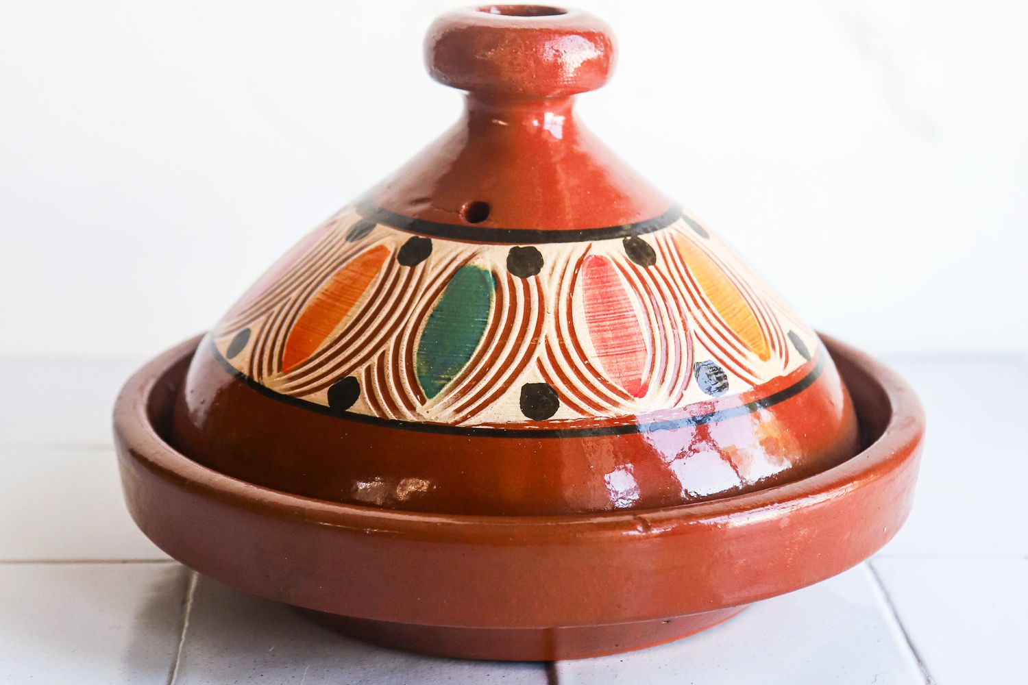 verve culture tagine on white tile surface