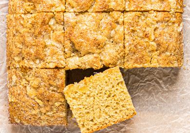 A closeup of a sliced snack cake with one piece slightly removed and placed at an angle