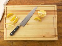 made in cutting board with a sliced lemon